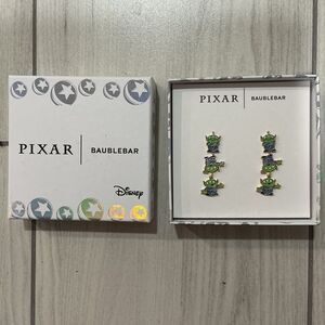 BaubleBar Disney Pixar Toy Story Alien drop earrings, featuring three interconne